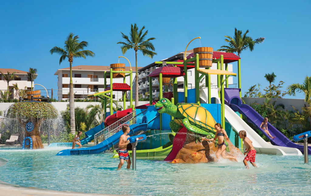 Family playing in waterperk at Dreams Playa Mujeres