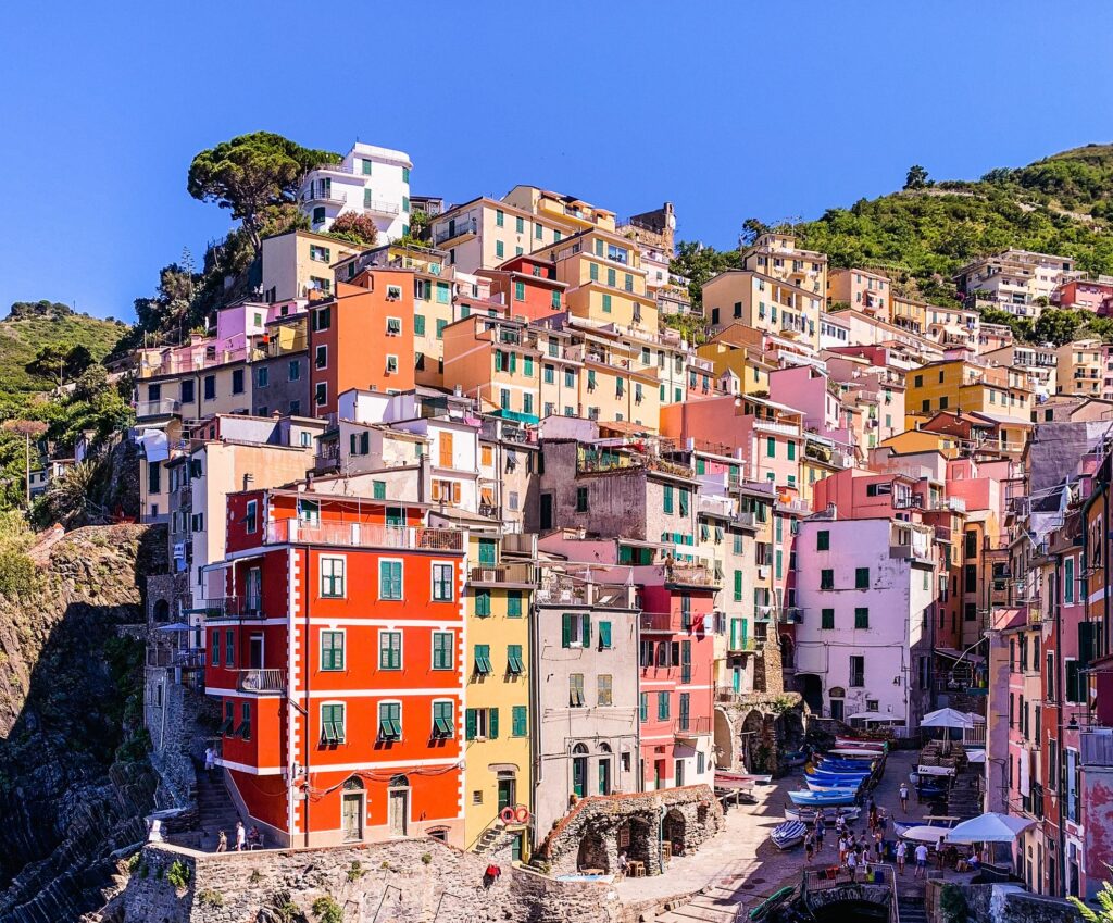 Colorful houses on a hill in Riomaggiore Northern Italy, honeymoon destination.