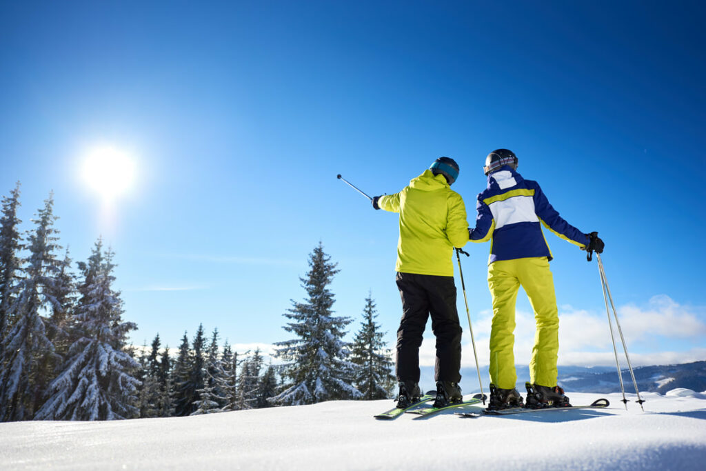 Romantic ski vacation couple skiing