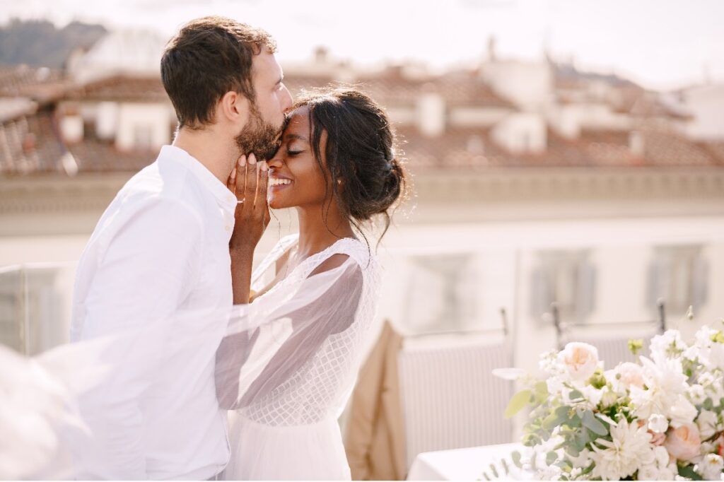 Couple embracing at an elopement, a top destination wedding trend of 2022.