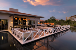 UNICO Mi Carisa restaurant terrace at sunset.