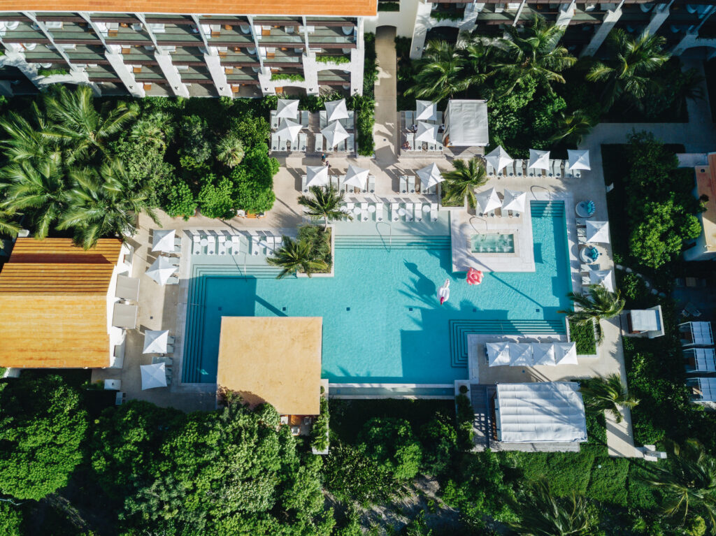 Birds-eye view of UNICO escondida pool with seating